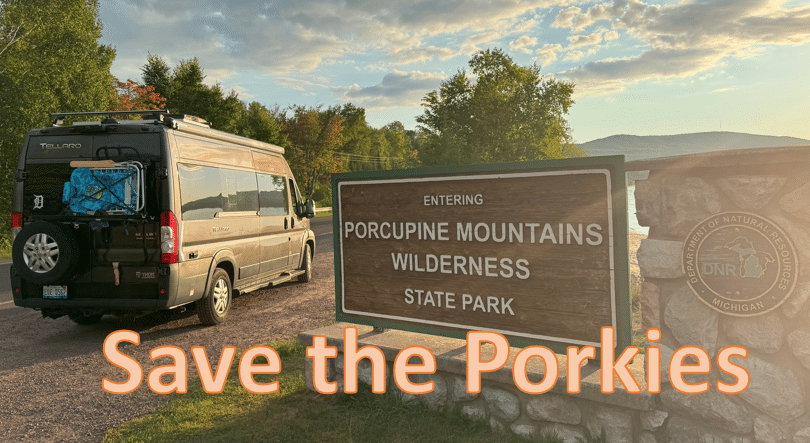 camper van entering Porcupine Mountain park in Michigan upper peninsula. titled 'save the porkies'..